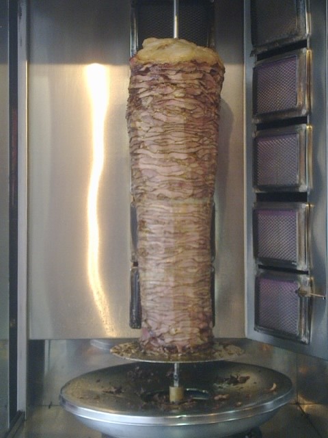 Turkey Shawarma Roasting on a vertical spit. Fun Joel. Israel Tour Guide.