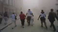 Civilians fleeing the debris cloud as the World Trade Center collapses on September 11, 2001