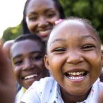 Smiling children representing diverse communities affected by sickle cell disease