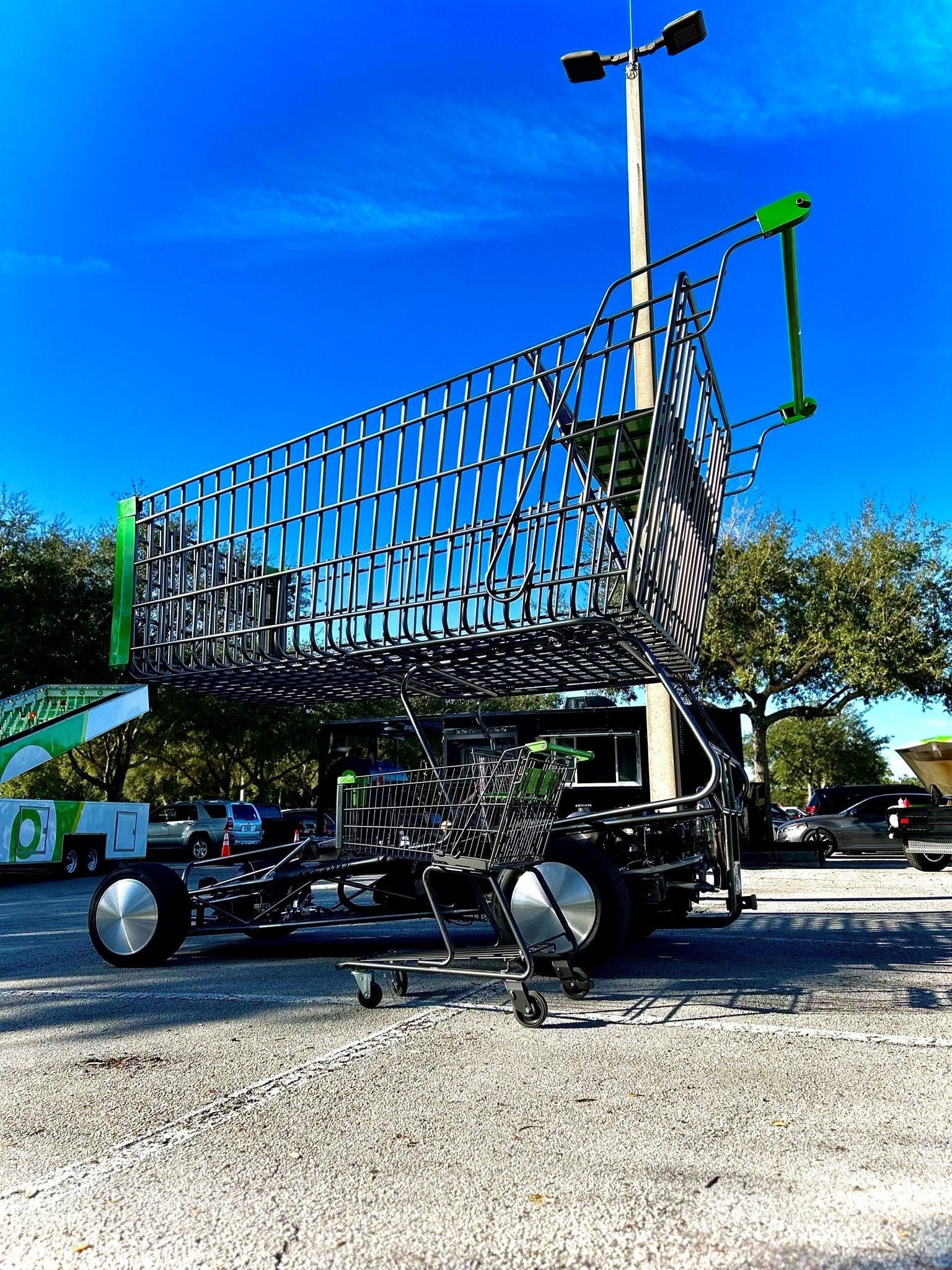 Giant Publix shopping cart with Publix logo and text "Shopping is a pleasure" to illustrate Publix store and shopping experience