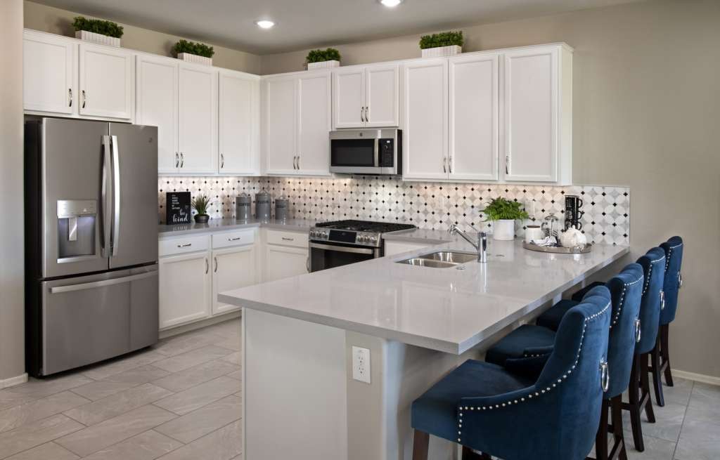 Kitchen with white cabinets and a peninsula