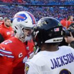 Lamar Jackson in action, a potential NFL MVP candidate, showcasing his skills on the field during an NFL game.