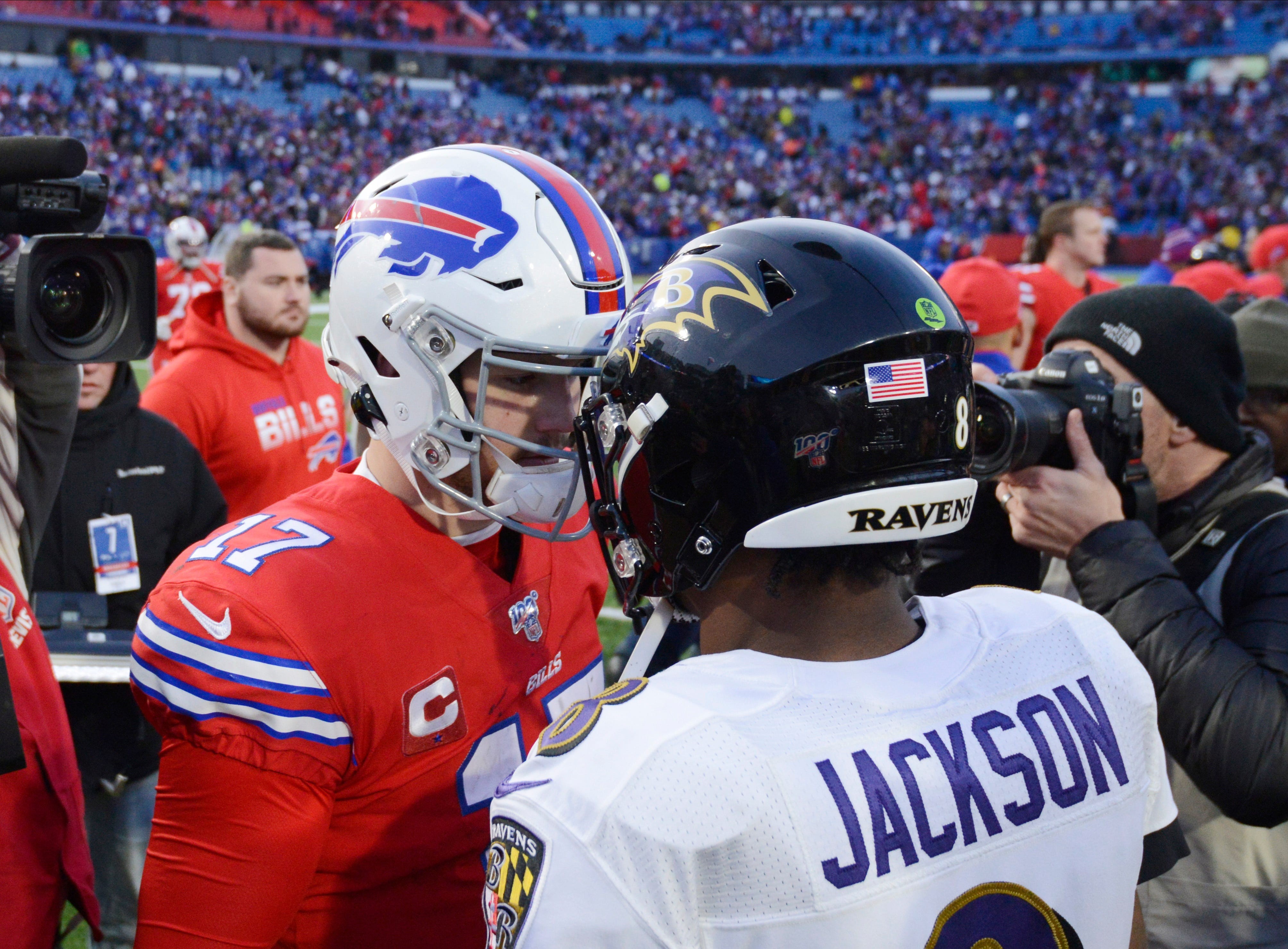 Lamar Jackson in action, a potential NFL MVP candidate, showcasing his skills on the field during an NFL game.