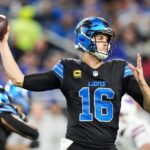 Fans excitedly watch a football game, anticipating the Super Bowl