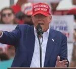 Donald Trump gesturing behind a lectern, EPA photo.