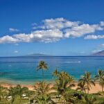 Beautiful sunny beach in Maui, Hawaii, showcasing the ideal weather for a visit any time of year.