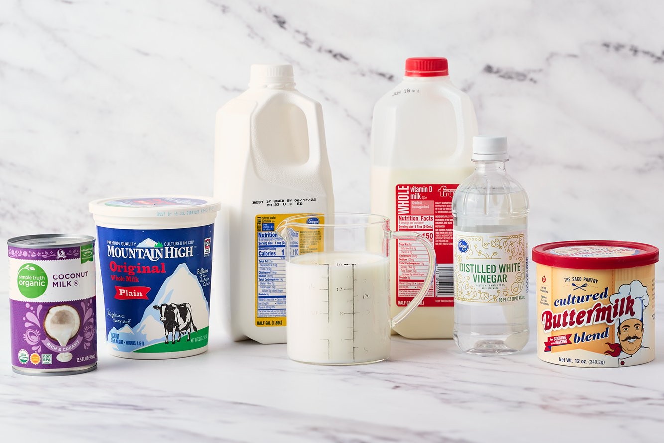 Bottles of buttermilk on display, showcasing different brands and packaging, highlighting the variety of buttermilk available for purchase.