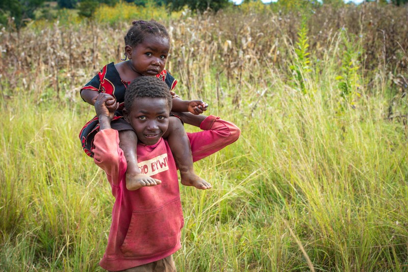 Brother showing love to sister by carrying her