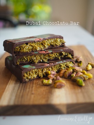 Close-up shot of Dubai Chocolate bar showing layers of chocolate, pistachio cream and kataifi pastry