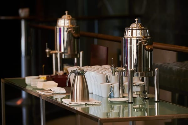 Coffee catering setup, showing options for serving coffee even without specialized espresso equipment, including alternatives for making an Americano-like drink.