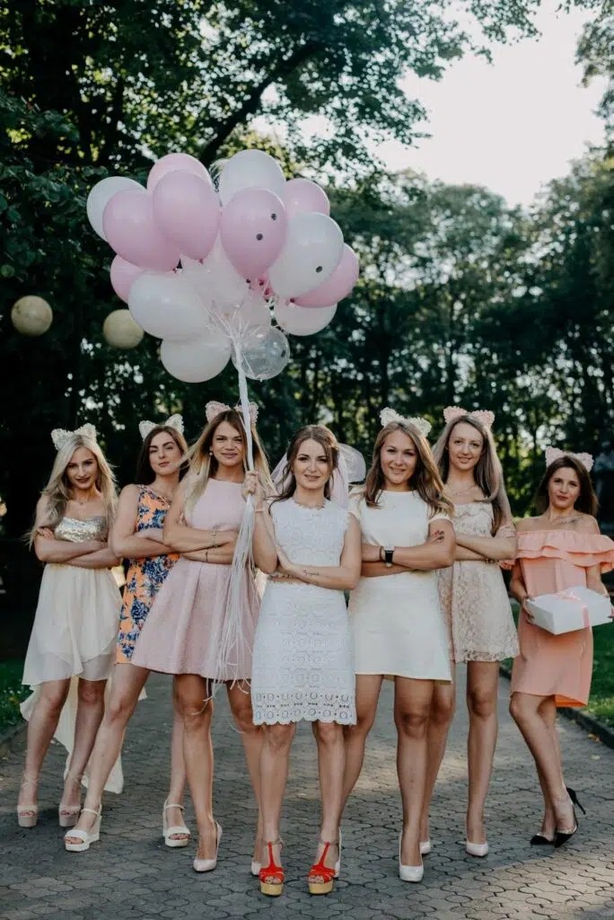 A bride-to-be stands with her best friends in attendance at her bridal party