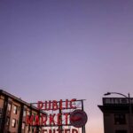 Seattle Pike Place Market bustling with people and colorful stalls