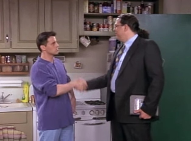 Joey from Friends confused by an encyclopedia, illustrating the limited nature of Facebook Free Basics.