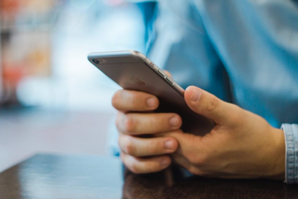 Person using a smartphone for communication