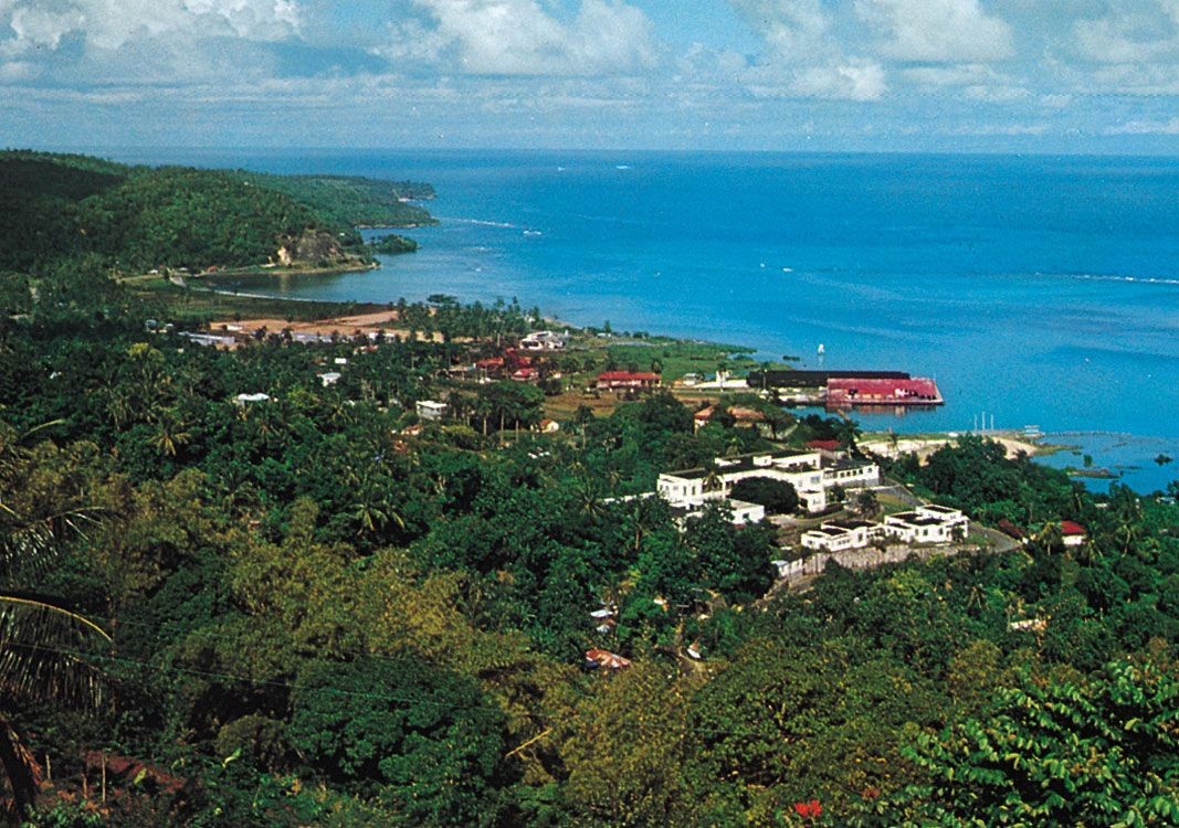 Aerial view of Port Antonio coastline in Jamaica showcasing the clear turquoise waters and lush greenery.