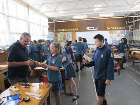 Students in a tech class at Blockhouse Bay Intermediate School in New Zealand, engaged in hands-on learning