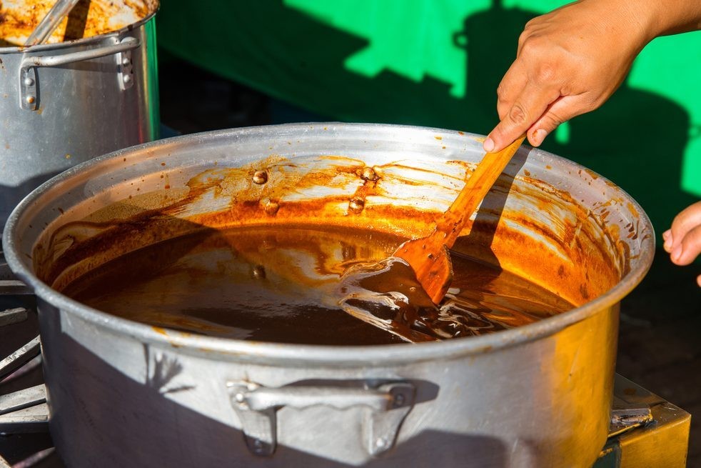 Close-up of rich mole sauce in a bowl, showcasing its thick texture and deep color