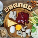 Foods rich in Biotin (vitamin B7). Foods as liver, eggs yolk, yeast, cheese, sardines, soybeans, milk, cauliflower, green beans, mushrooms, peanuts, walnuts and almonds. Image Credit: By Evan Lorne / Shutterstock