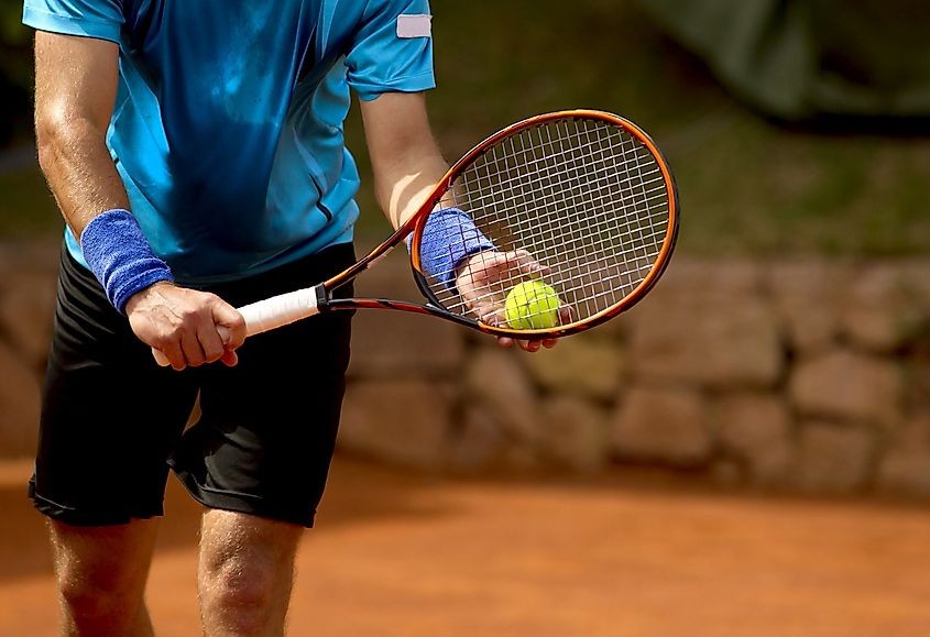 A tennis player serving during a tennis match