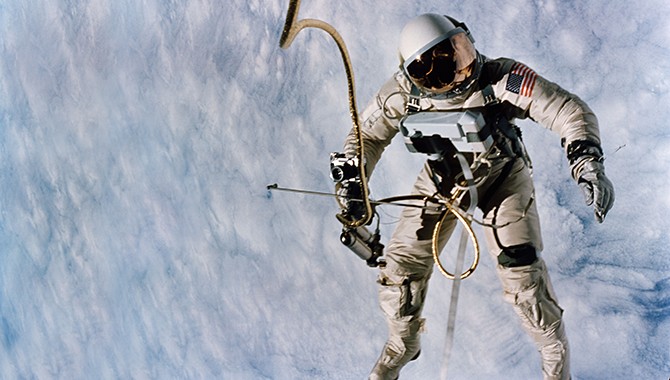 NASA astronaut Ed White during the first American spacewalk, a pivotal moment in the Gemini IV mission conducted in June, highlighting human capability in space during the Gemini month.