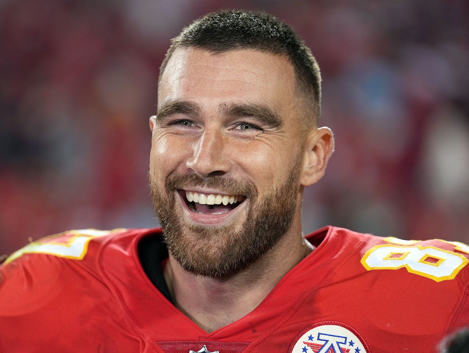 Travis Kelce in action for the Kansas City Chiefs, showcasing his jersey number 87.