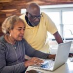 Smiling senior woman using a tablet, representing online access to Social Security information and benefit management.