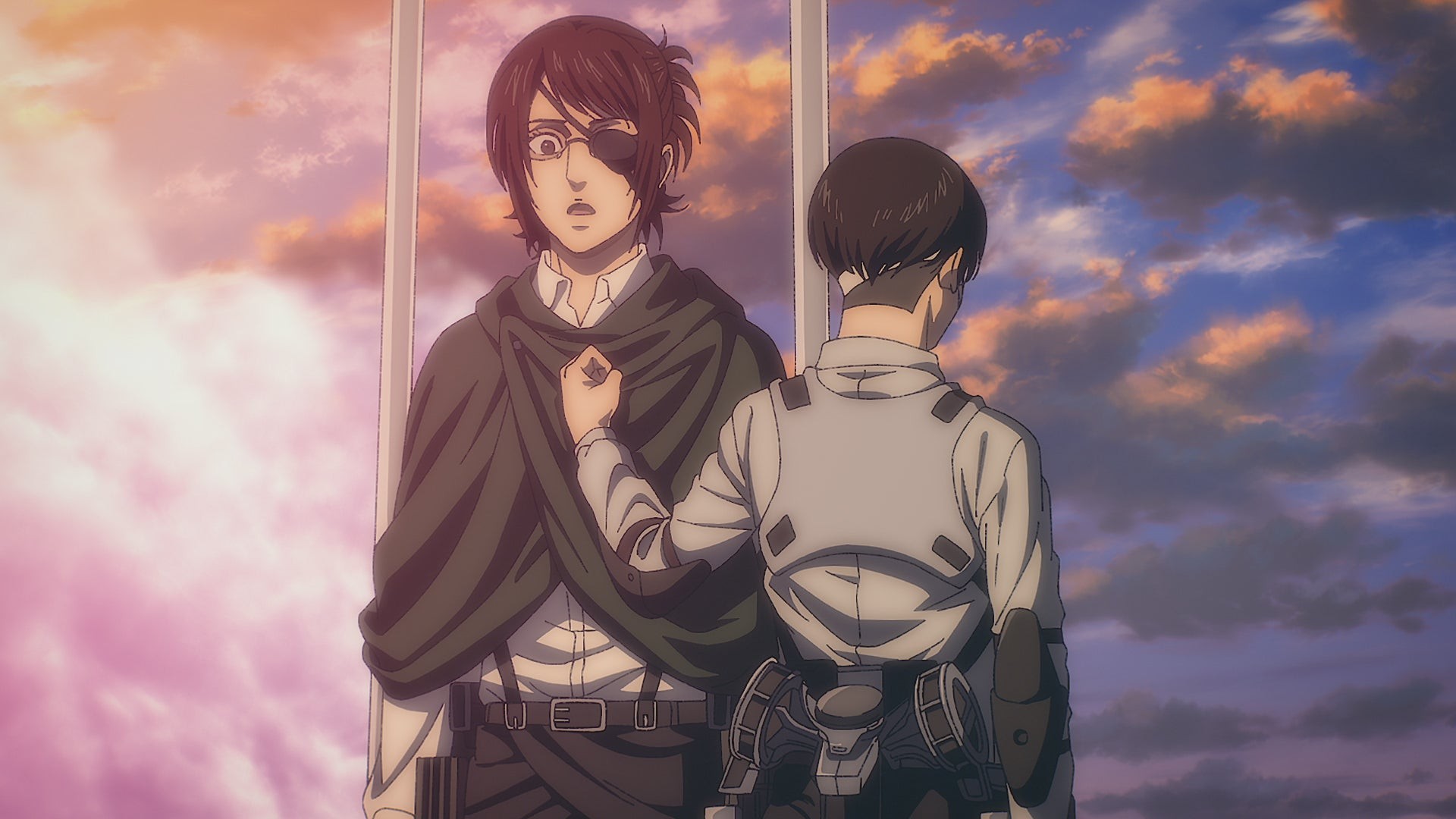 A man with an eyepatch and a person with their back to us