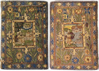 Tapestry fragment showcasing silk and metal threads, highlighting the intricate details and luxurious materials used in high-end tapestries