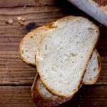 Close-up of sourdough bread showing the texture and airy interior