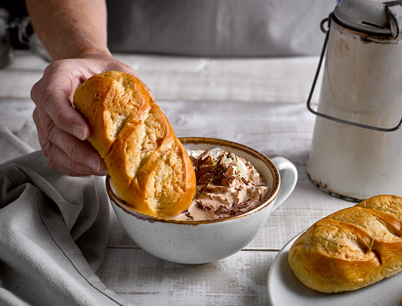 Brioche Roll Dunked Into Hot Chocolate