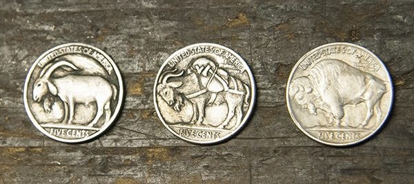 Engraved buffalo side of a hobo nickel next to an original buffalo nickel