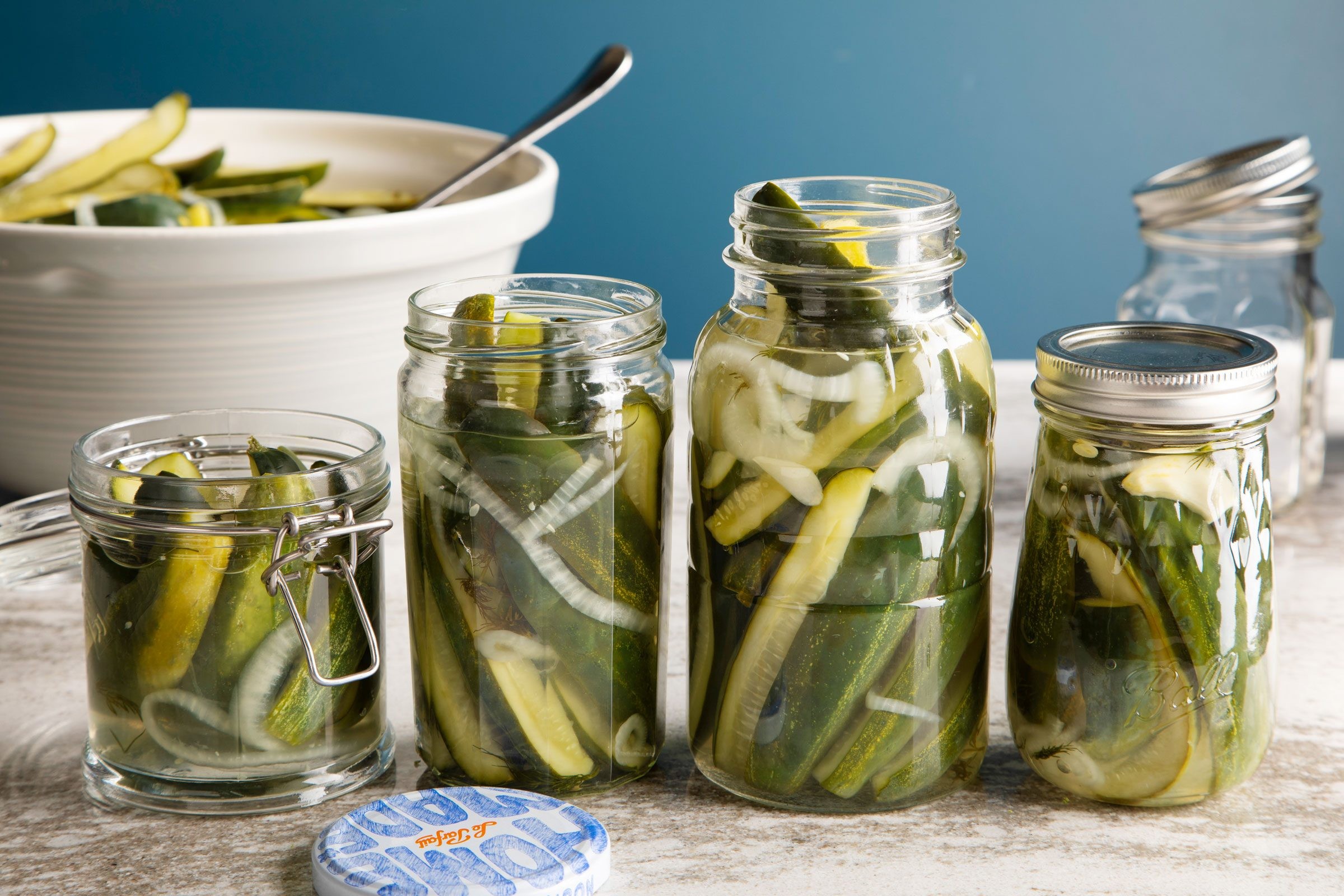 Pickle wedges in mason jars during the canning process