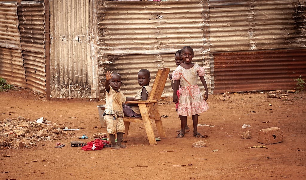 Aid worker helping children
