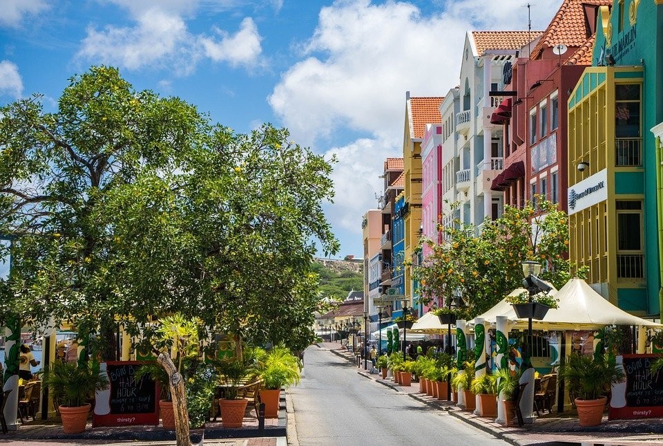 A vibrant scene from Curaçao, showcasing the island's cultural richness and linguistic diversity with Papiamento as a key language