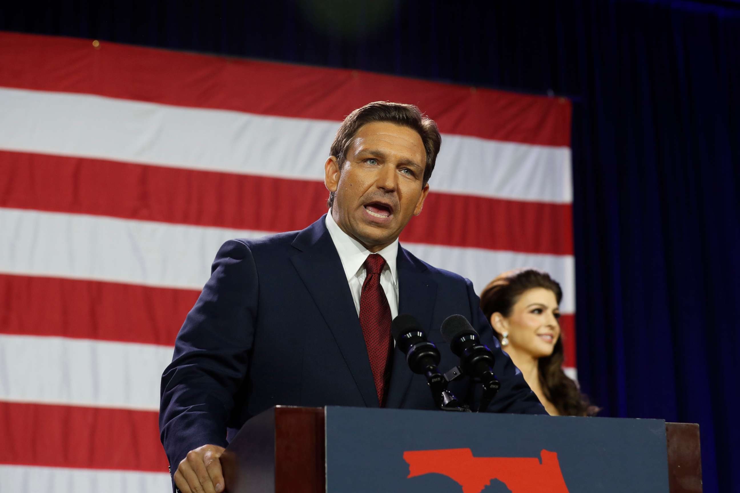Florida Gov. Ron DeSantis delivering a victory speech, highlighting the political dimensions of the term woke