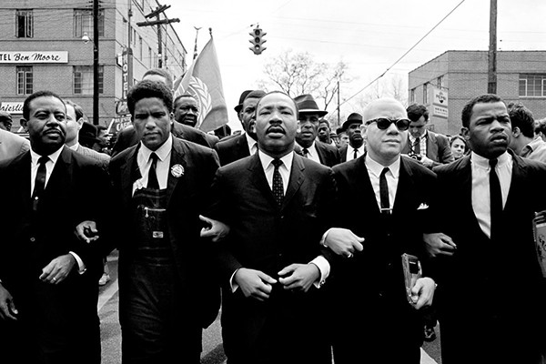 Dr. Martin Luther King Jr. delivering a speech during the March on Washington, advocating for jobs and freedom