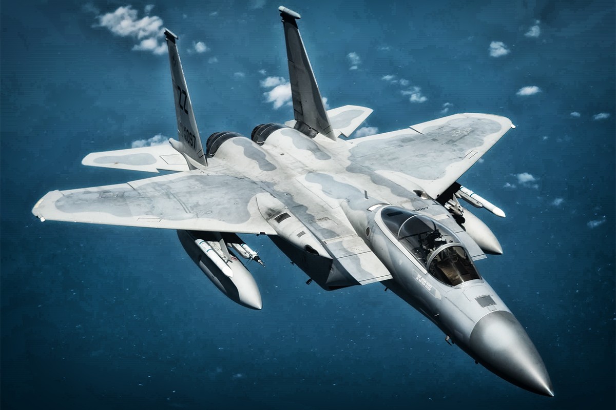 Fighter jet in flight from above, capturing the agility and precision of an F-15C Eagle during a training exercise at Kadena Air Base, Japan