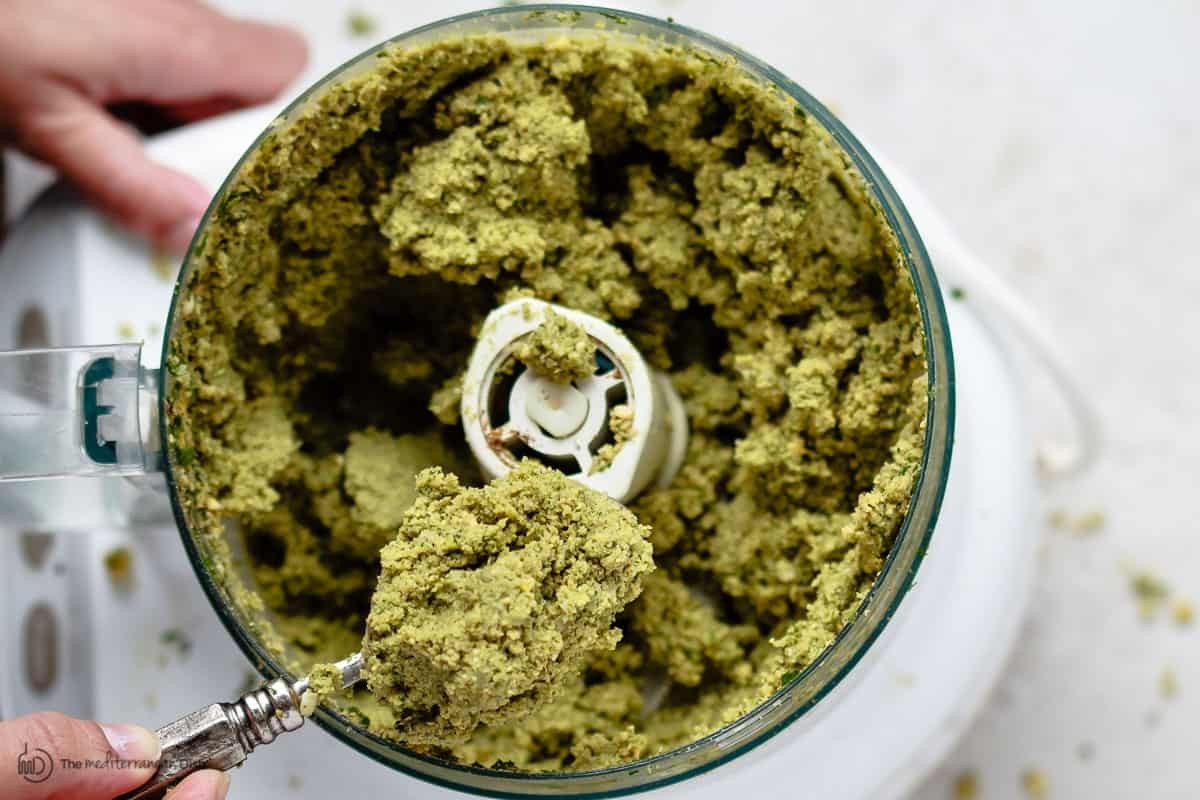 Falafel ingredients being prepared: soaking chickpeas, chopping herbs, and grinding spices