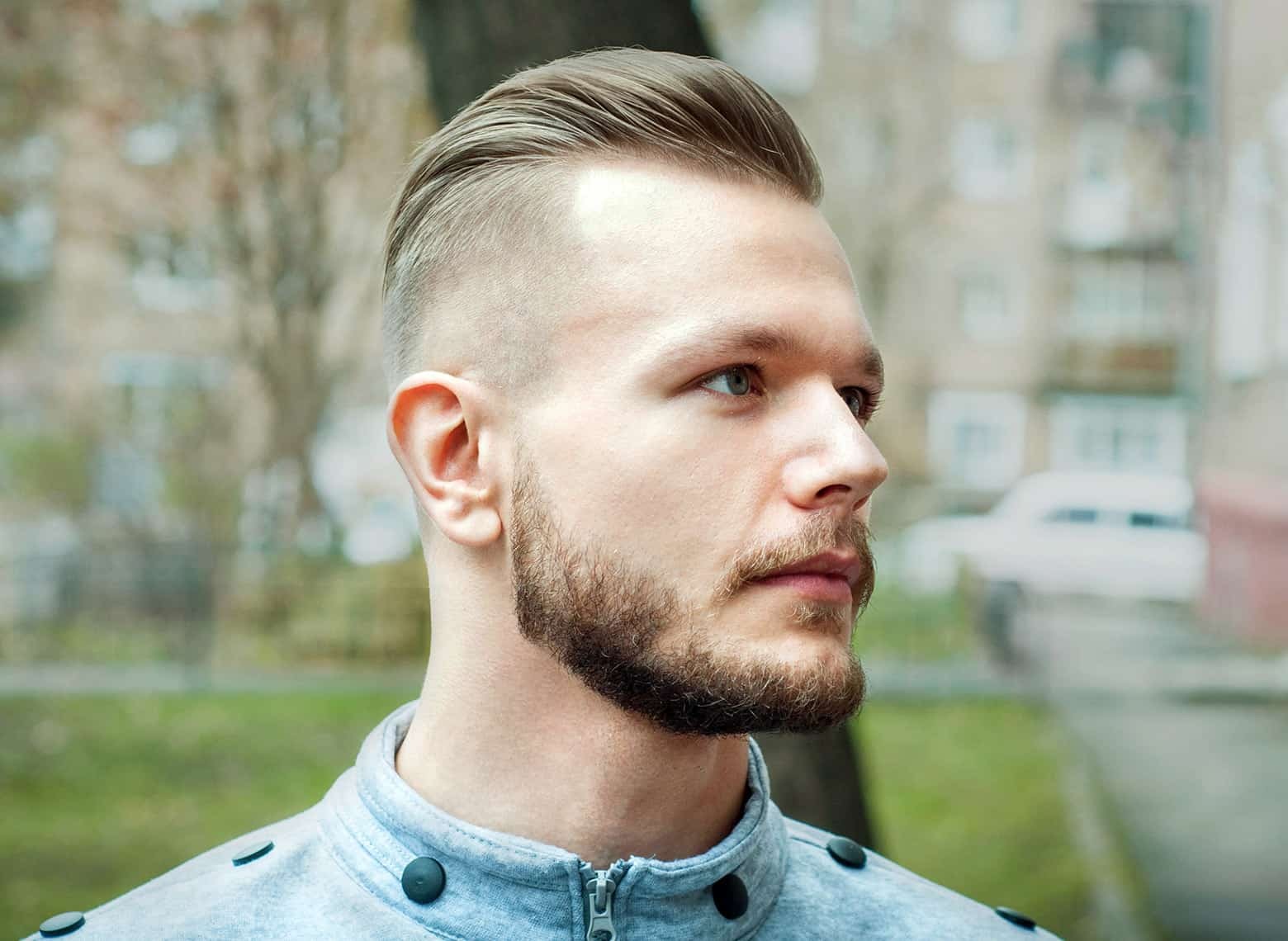 Image showcasing a mid taper fade haircut, where the fade starts at the midway point on the sides of the head