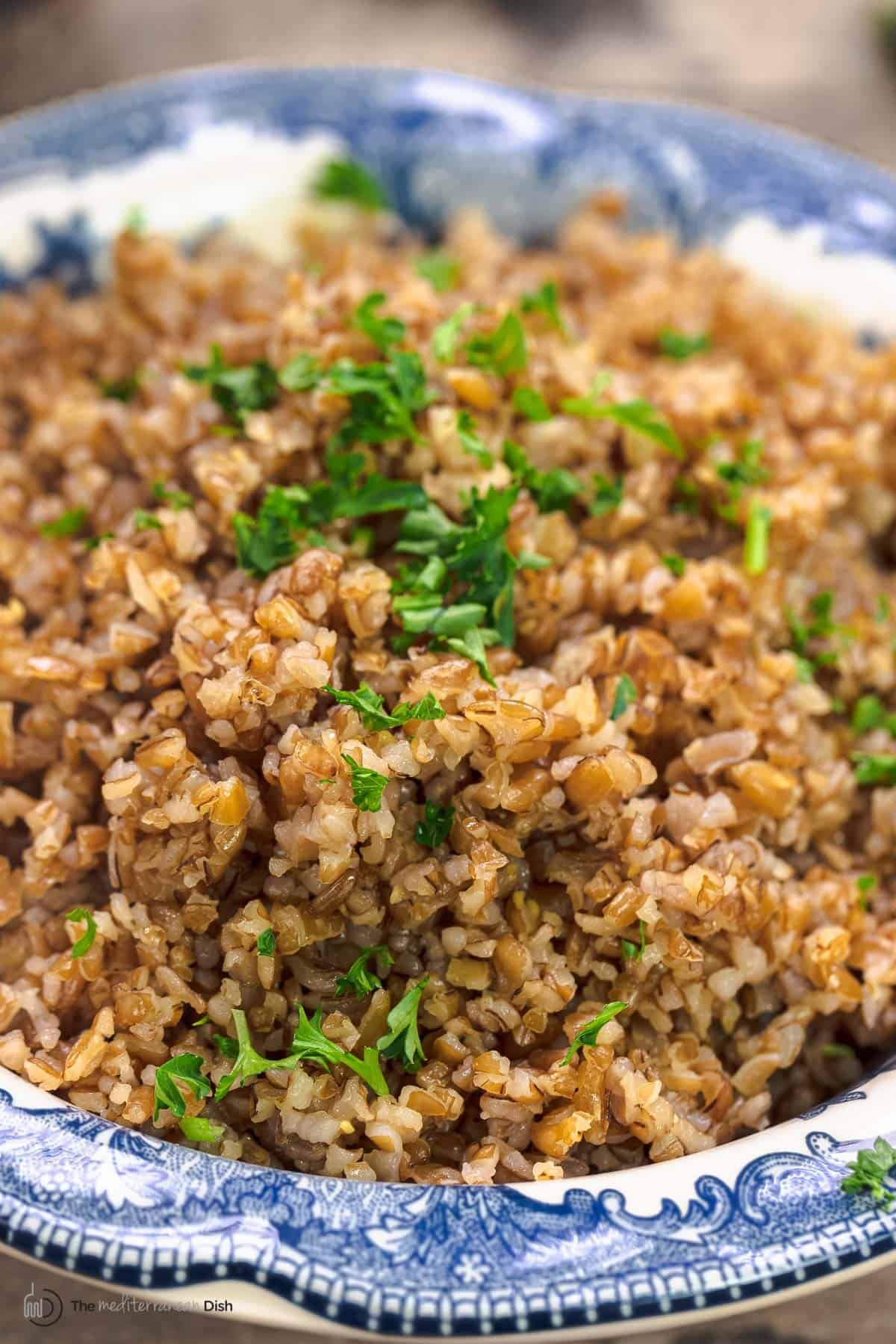 Close up of cooked coarse bulgur wheat in a bowl