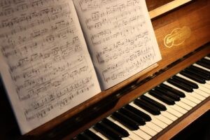 A close-up of a pianist playing sheet music