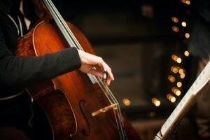 A cellist performing in an orchestra
