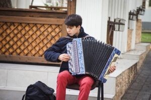 An accordion player performing outdoors