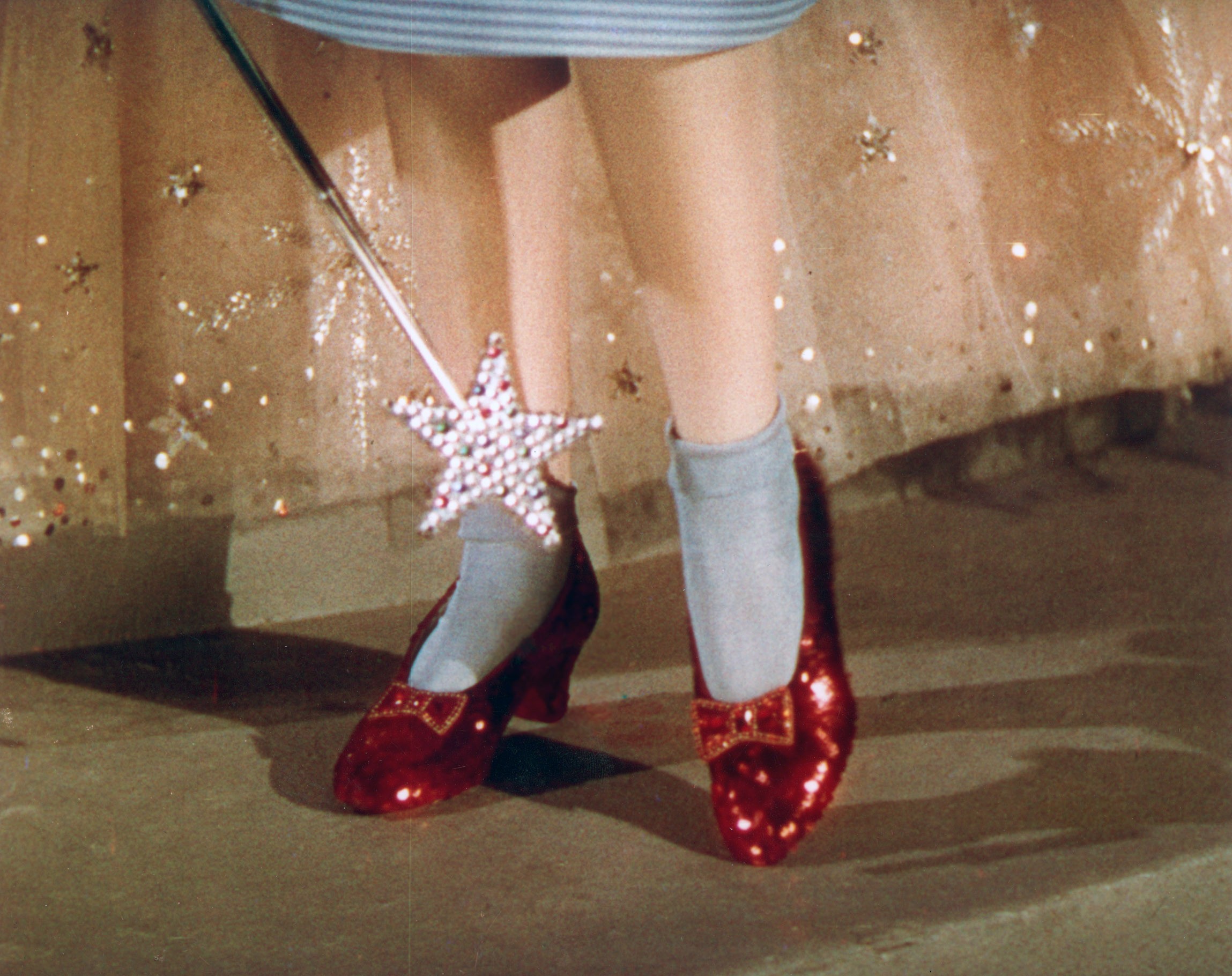 Judy Garland as Dorothy Gale wearing the Ruby Slippers in "The Wizard of Oz"