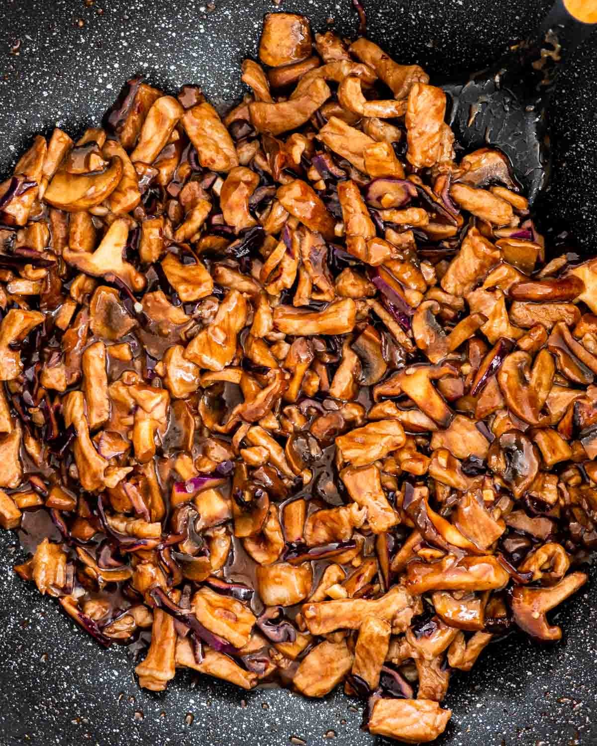 Moo shu pork in a wok.