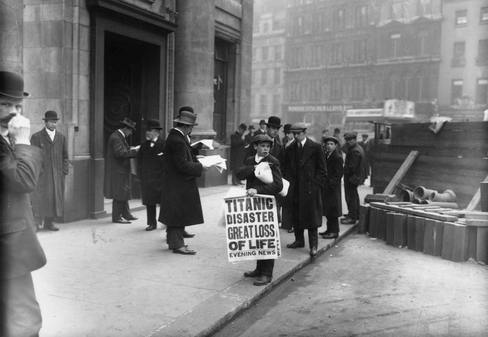 Newspaper boy selling news about the Titanic sinking