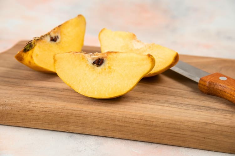 A quince fruit resembling a yellow apple