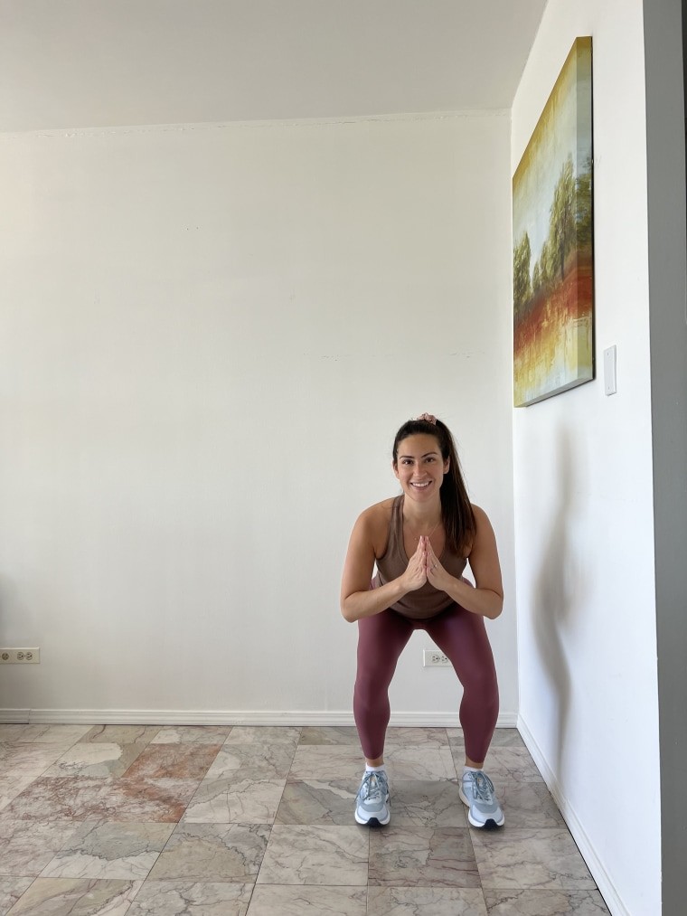Woman doing a lateral shuffle as part of a tabata workout