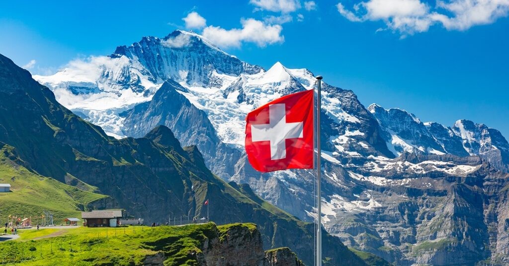 Swiss Alps with mountains and a Swiss flag