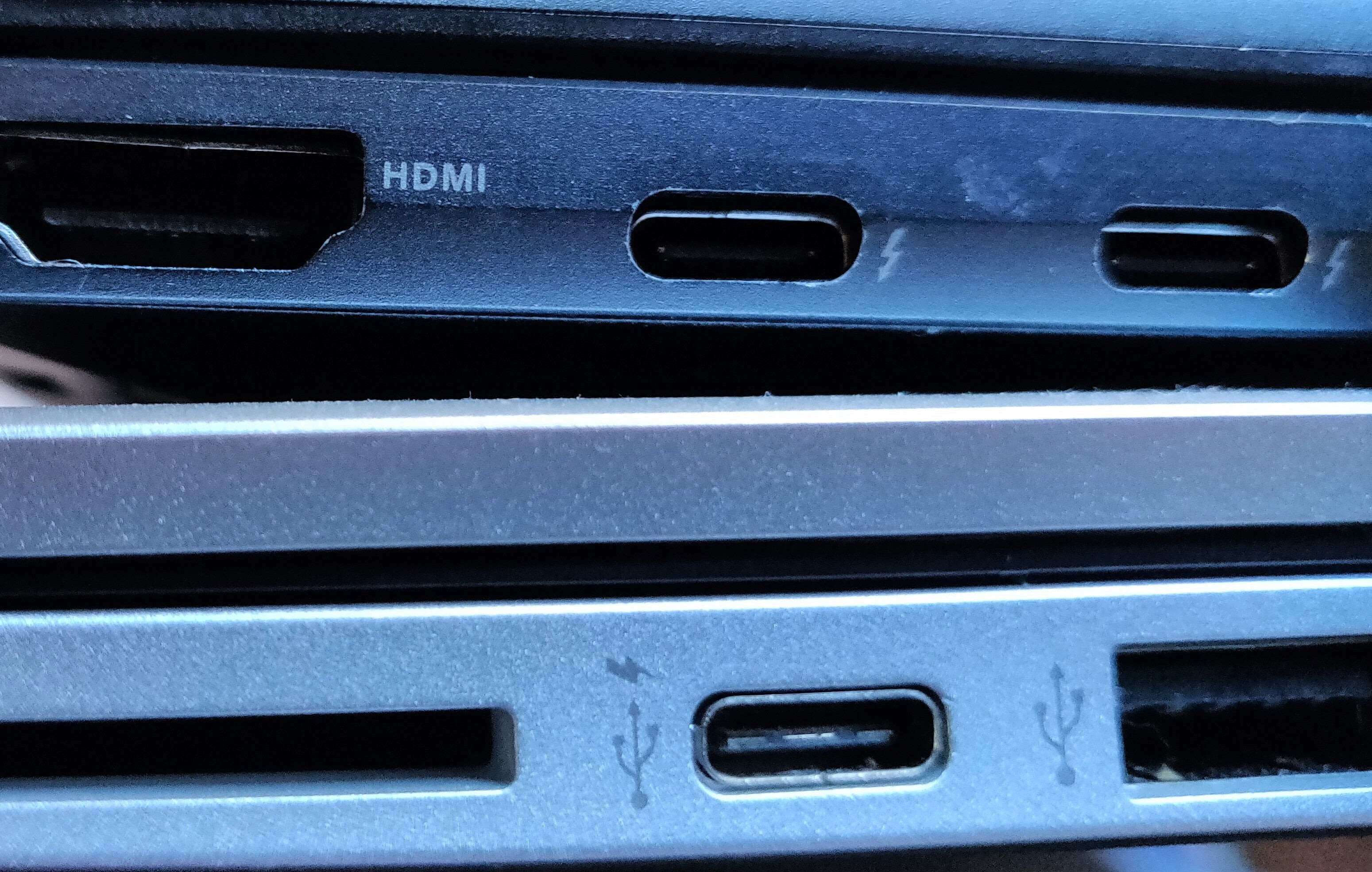 Comparing Thunderbolt vs USB-C symbols on laptops